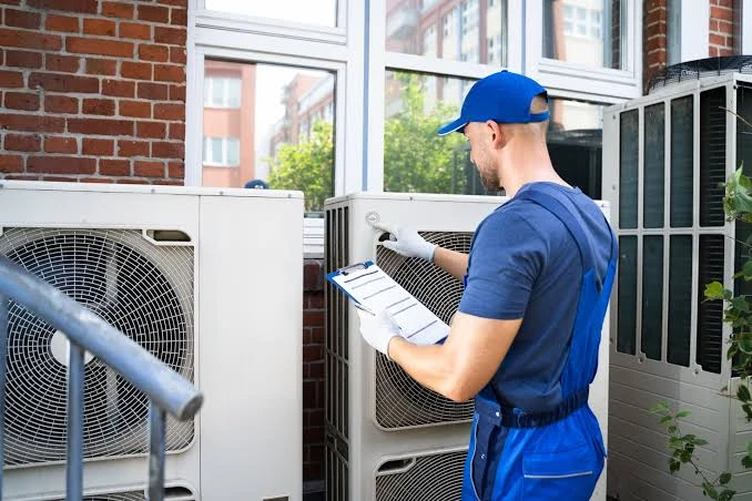 Illustrative technician completing an outdoor HVAC inspection checklist